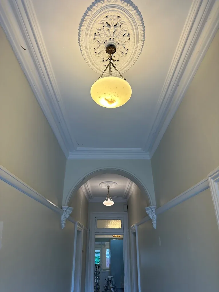 Restored heritage ceiling rose and pendant light